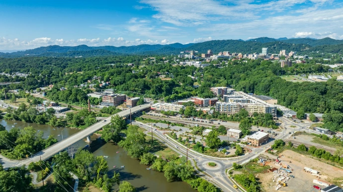 An aerial view of a city with a river running through it